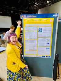 Emily Howling exhibiting her poster at IBIC 2025